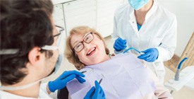 Woman smiling at dental office 