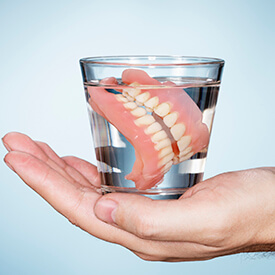 dentures in glass or water
