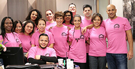 dental team wearing breast cancer shirts