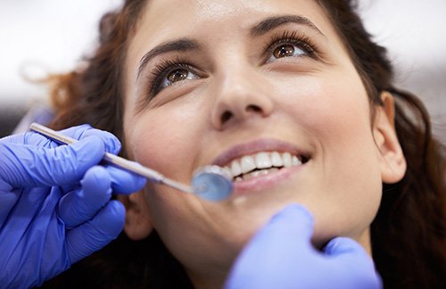 smiling woman about to have a dental checkup